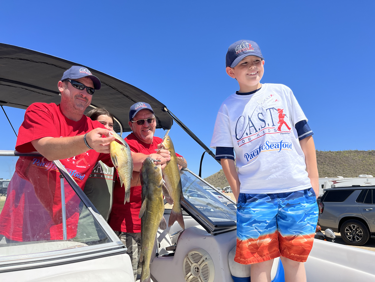 LakePleasant3 participant on boat holding a fish