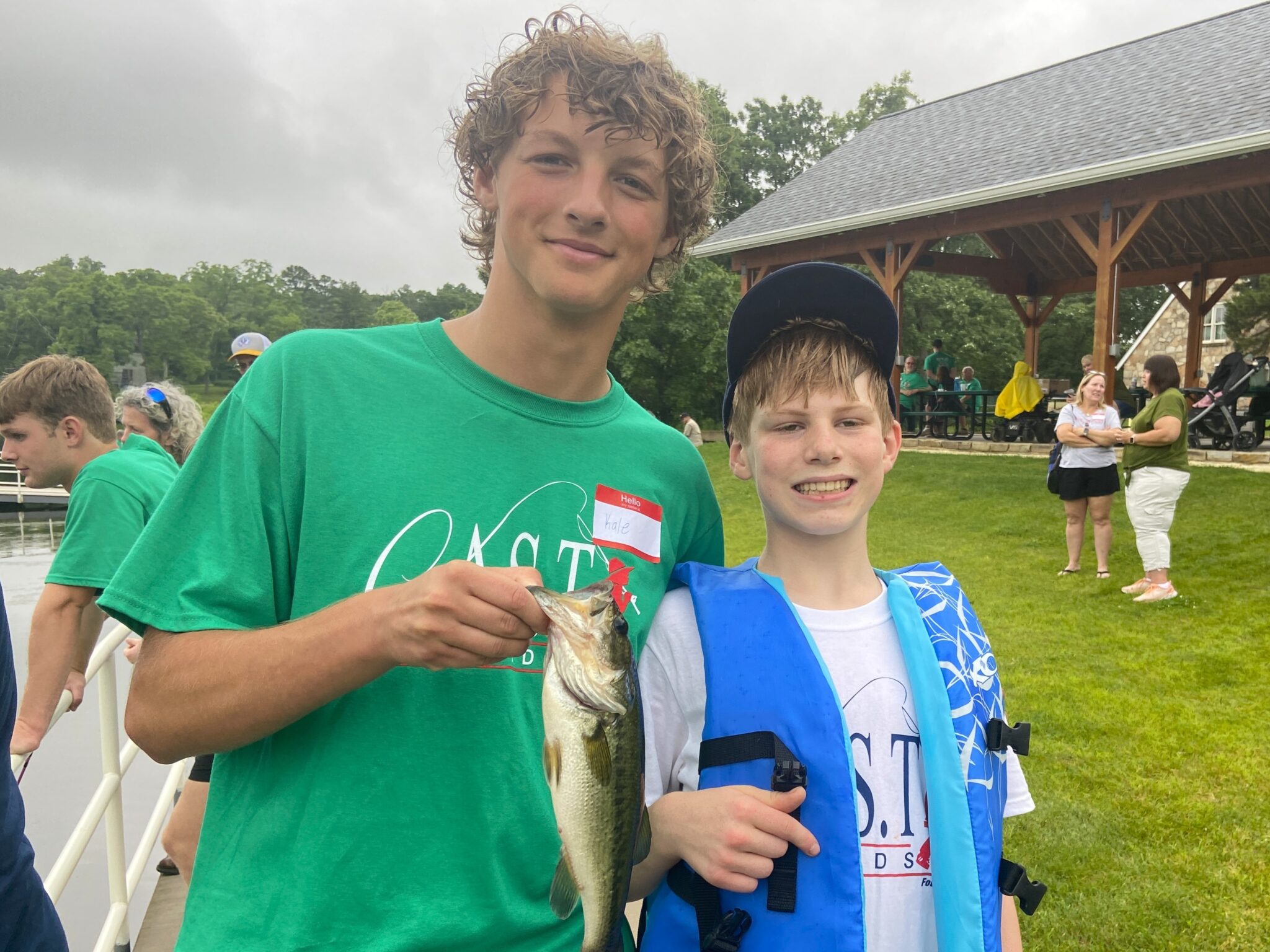 25KempLake2 two participants holding a fish at Kemp Lake