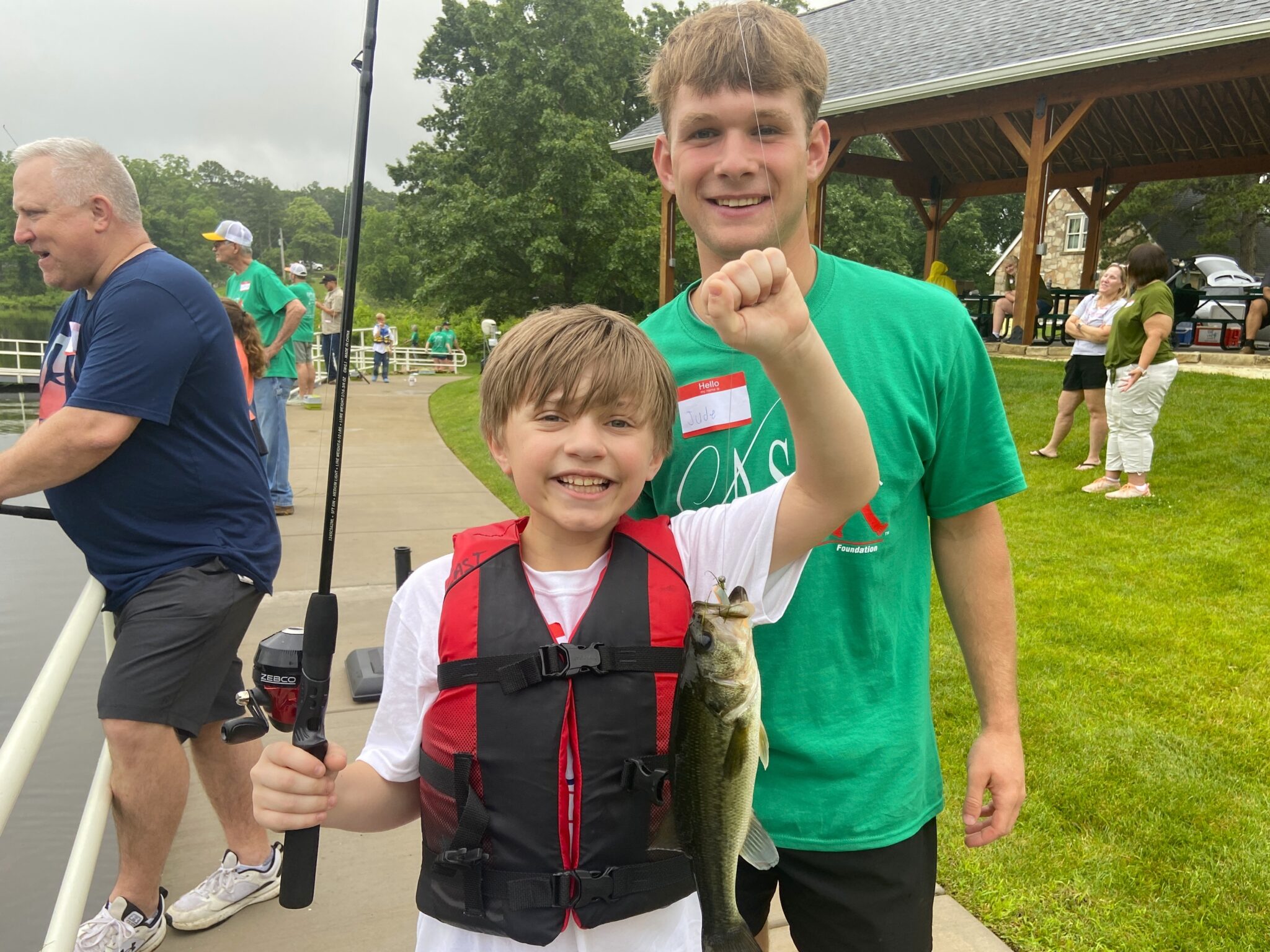 25KempLake4 two young boys holding a fish at Kemp Lake