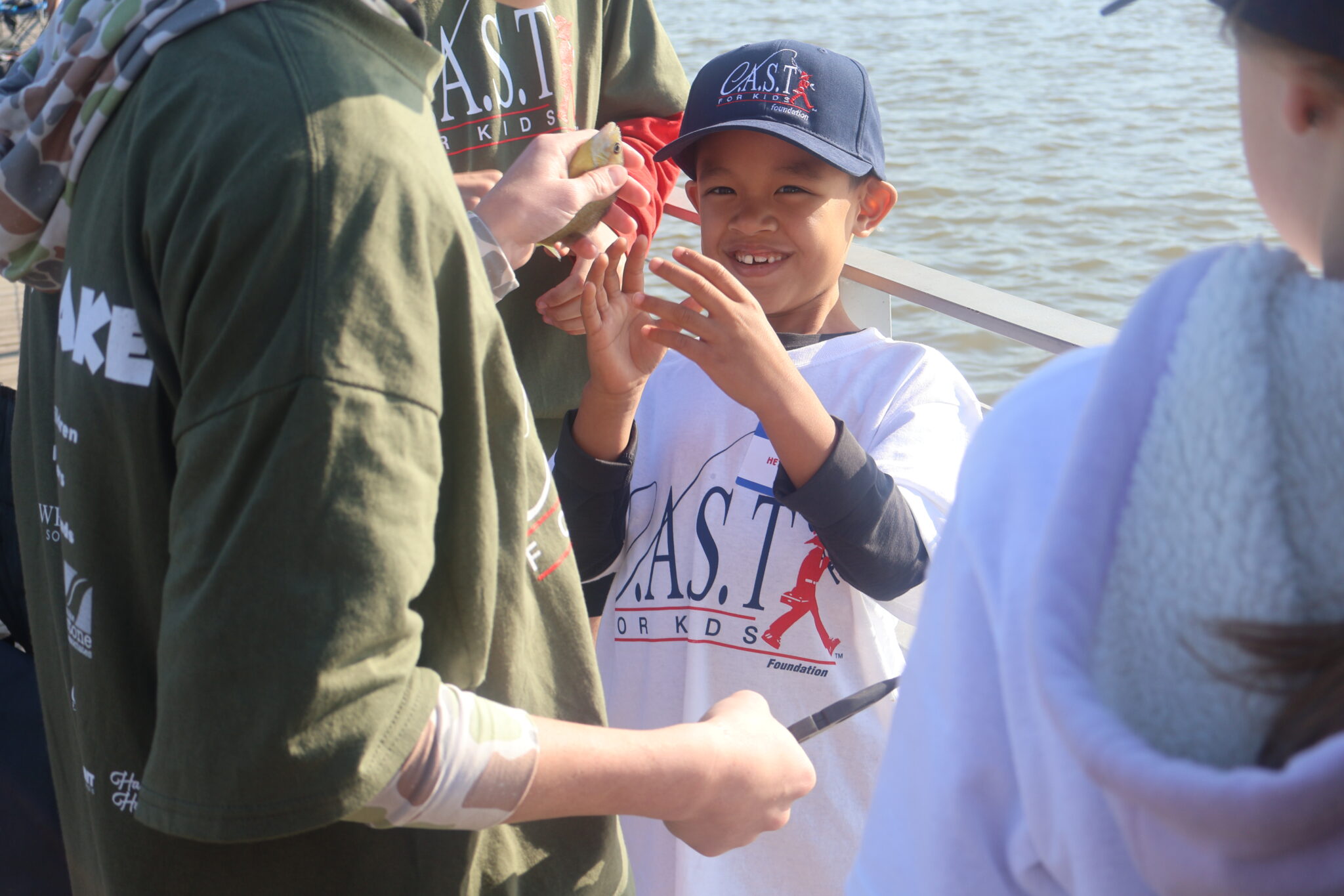 West Lake4 a kid looking at a fish