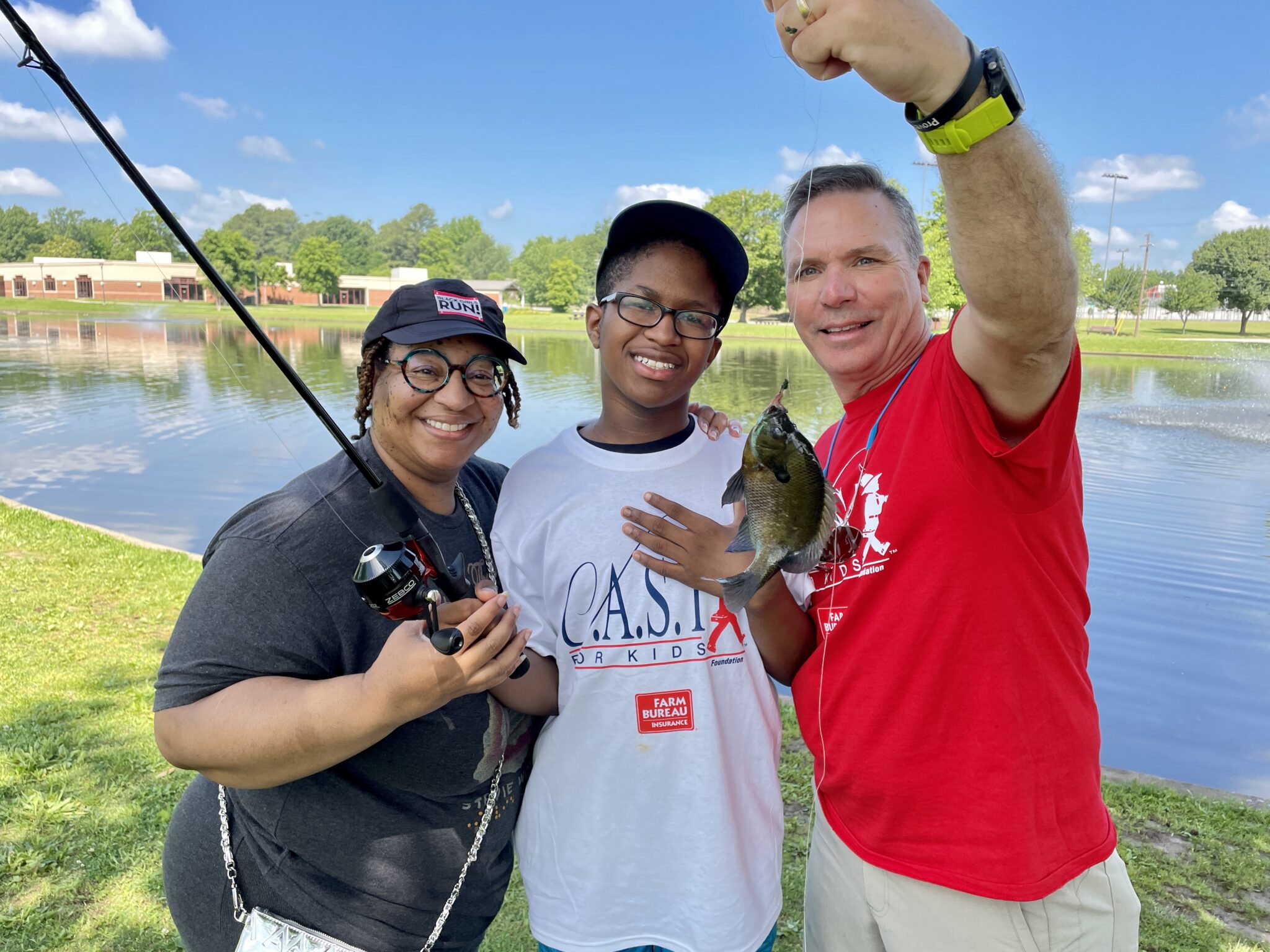 IMG_7350 volunteers with a caught fish with young people