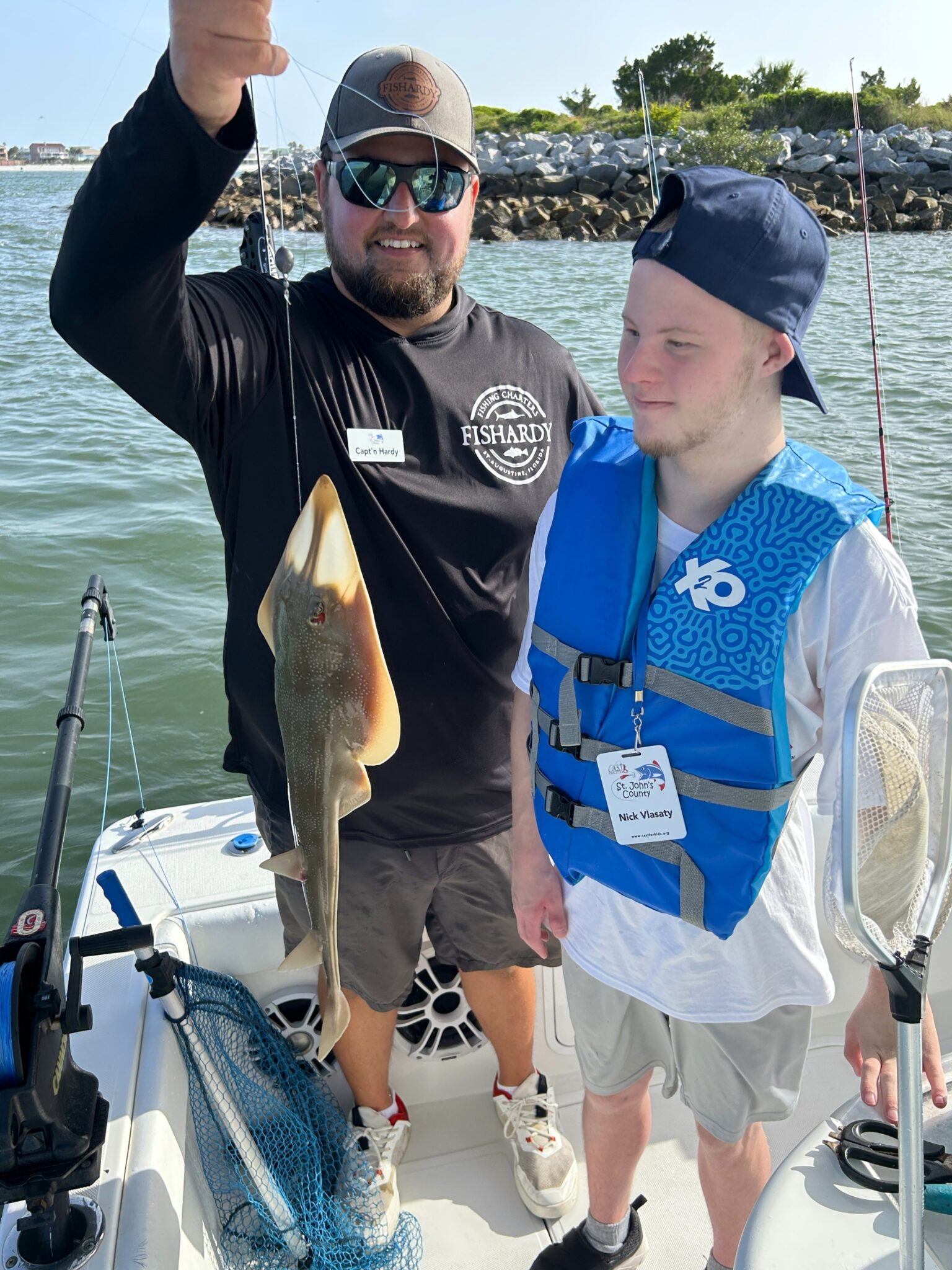 25StJohnsCounty2 young kid showing off fish at st johns county