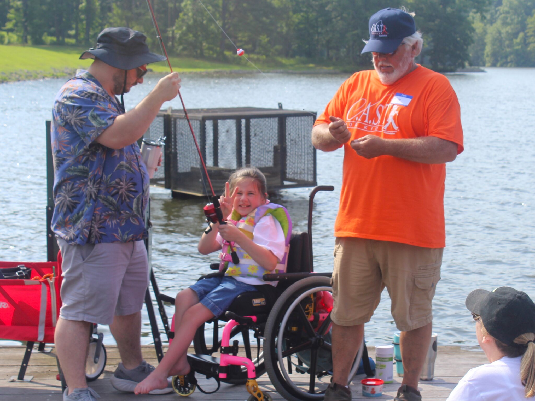25IndianLake1 child in wheelchair fishing at indian lake