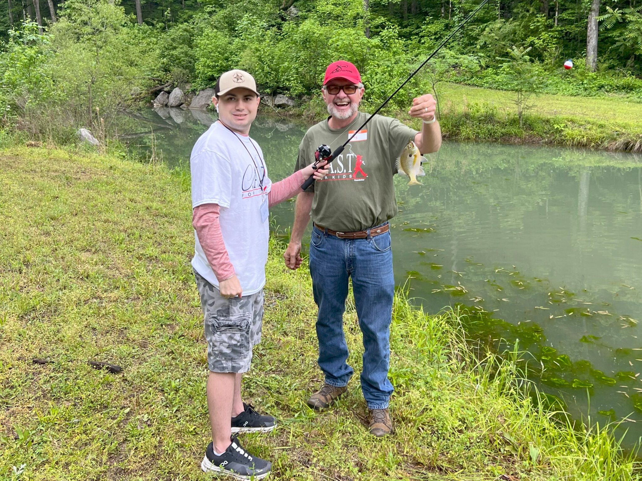 25ChandlerBranch2 two people holding fish at chandler branch
