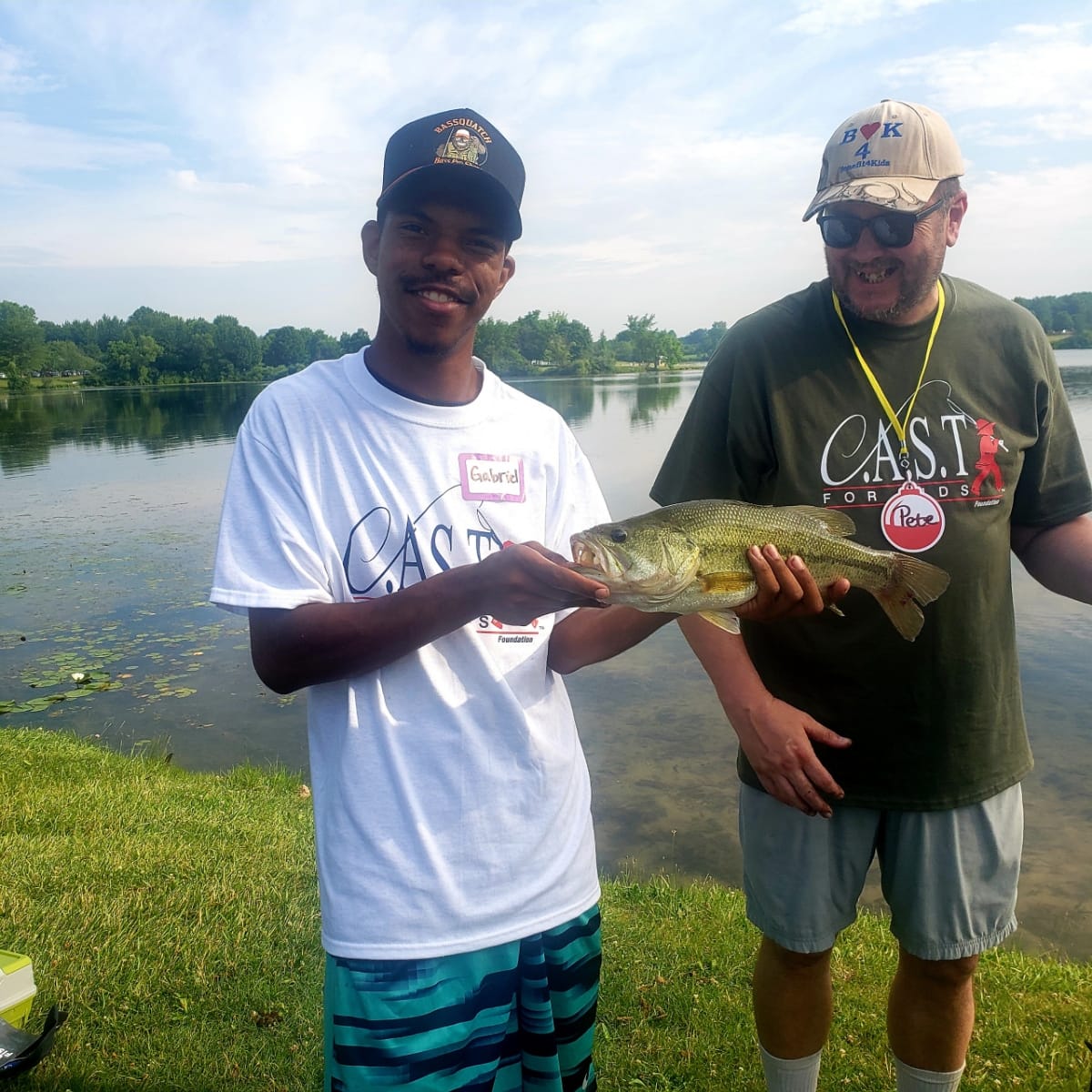 Big Seven Lake2 volunteer and participant with a fish in a boat