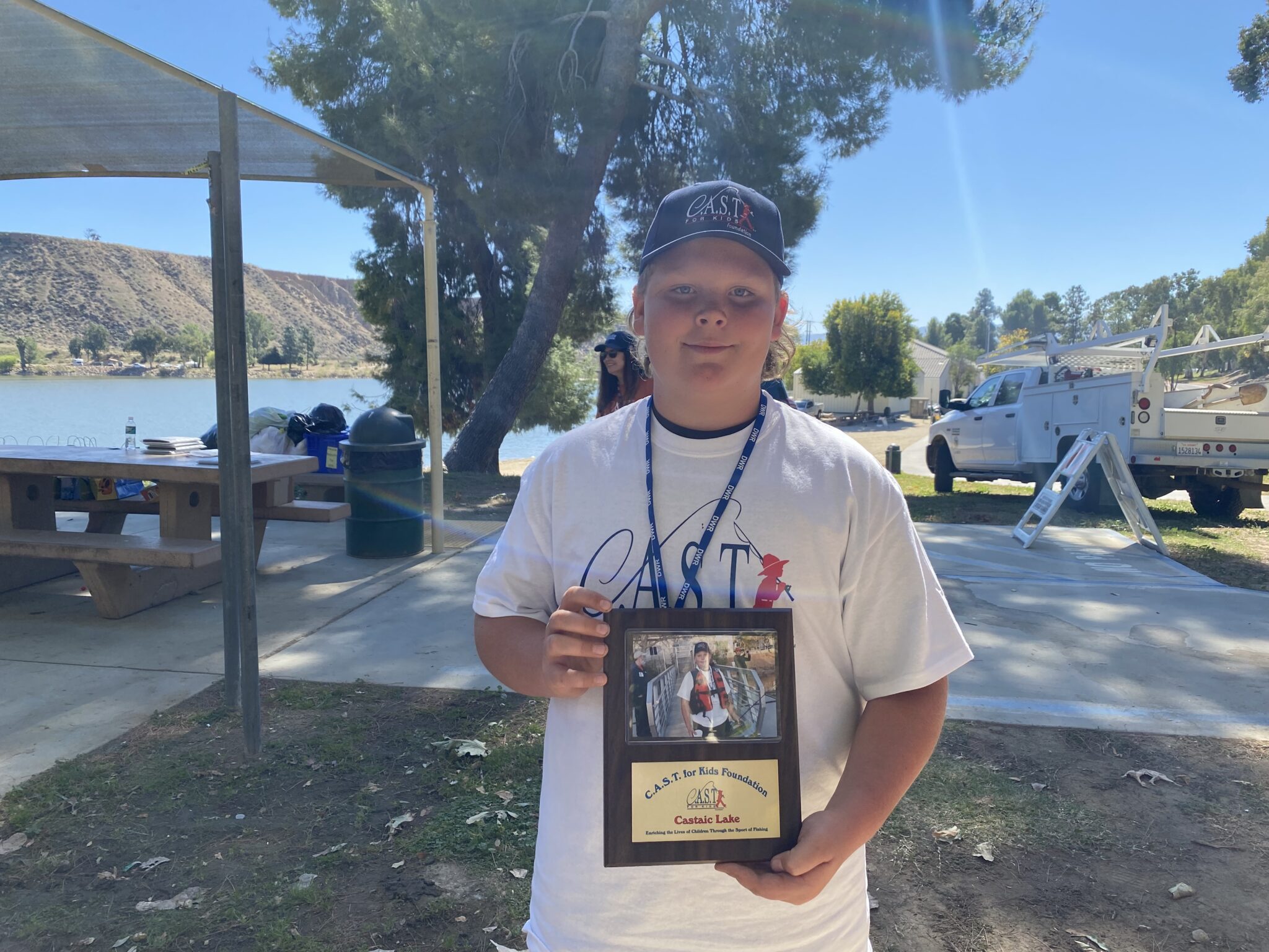 Castaic Lake 1 boy holding plaque at Castaic Lake State Recreation Area