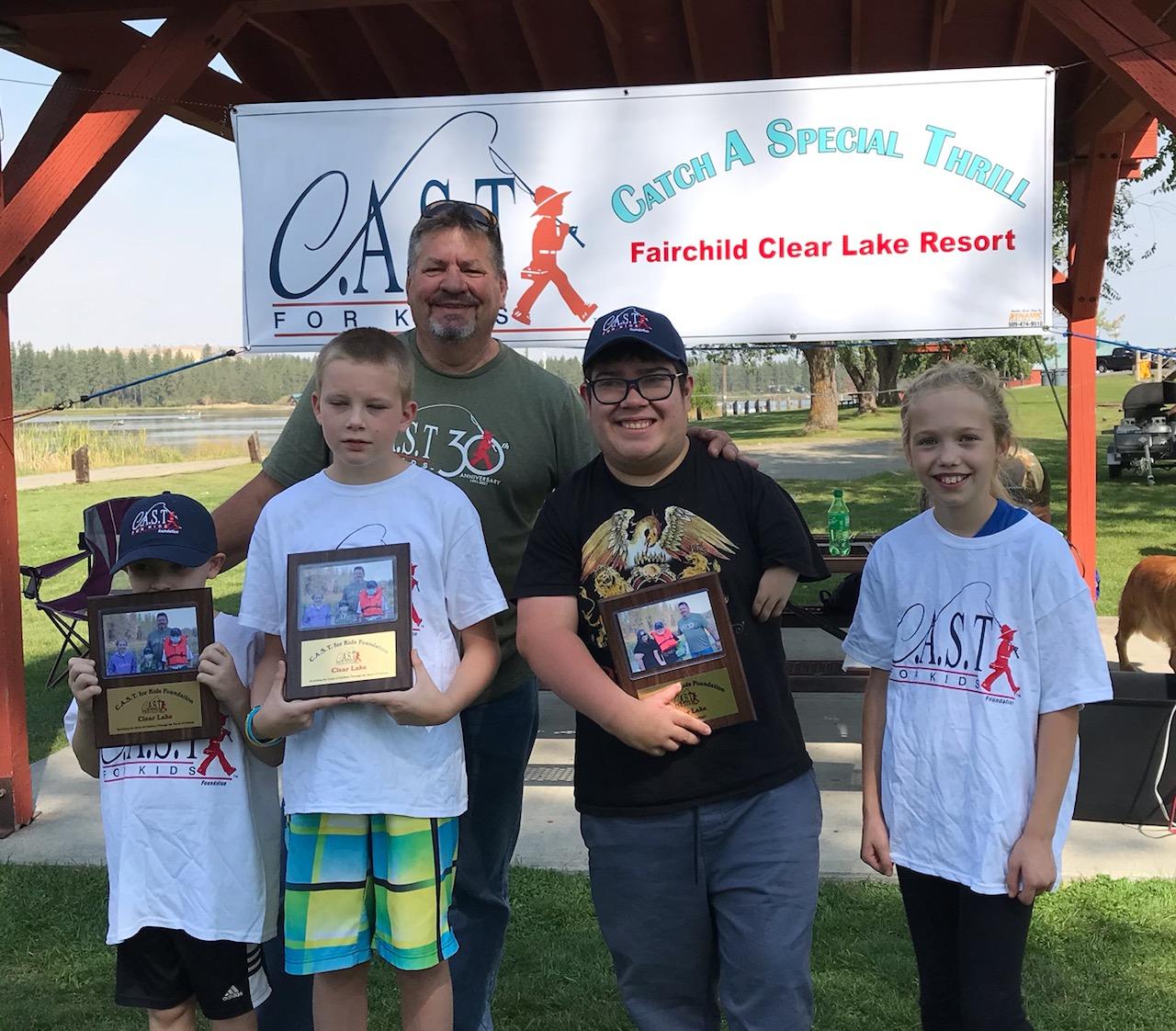 four kids with plaques at clear lake