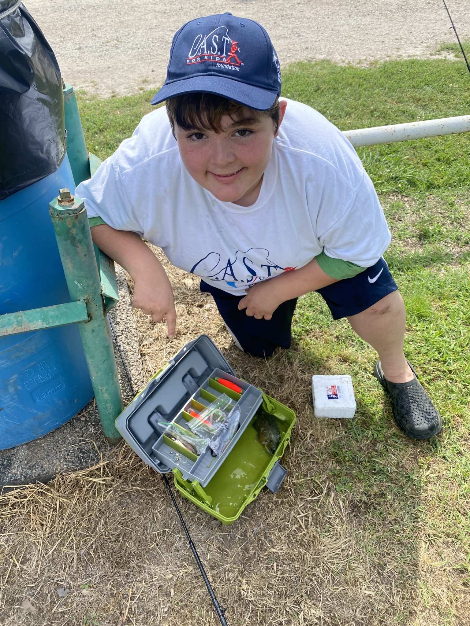Lake Bonham Park4 boy showing off tackle box at Lake Bonham Park