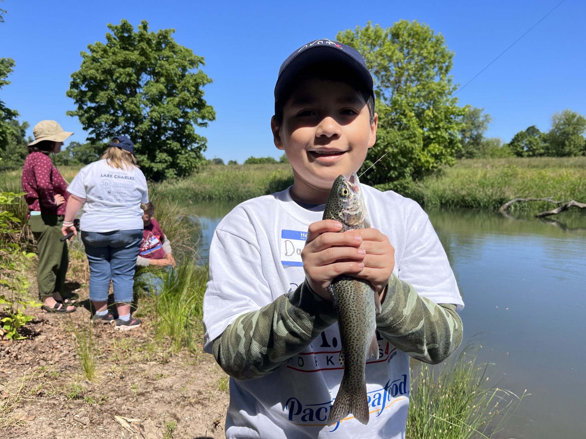 Lake Charles2 participant holding fish at lake charles