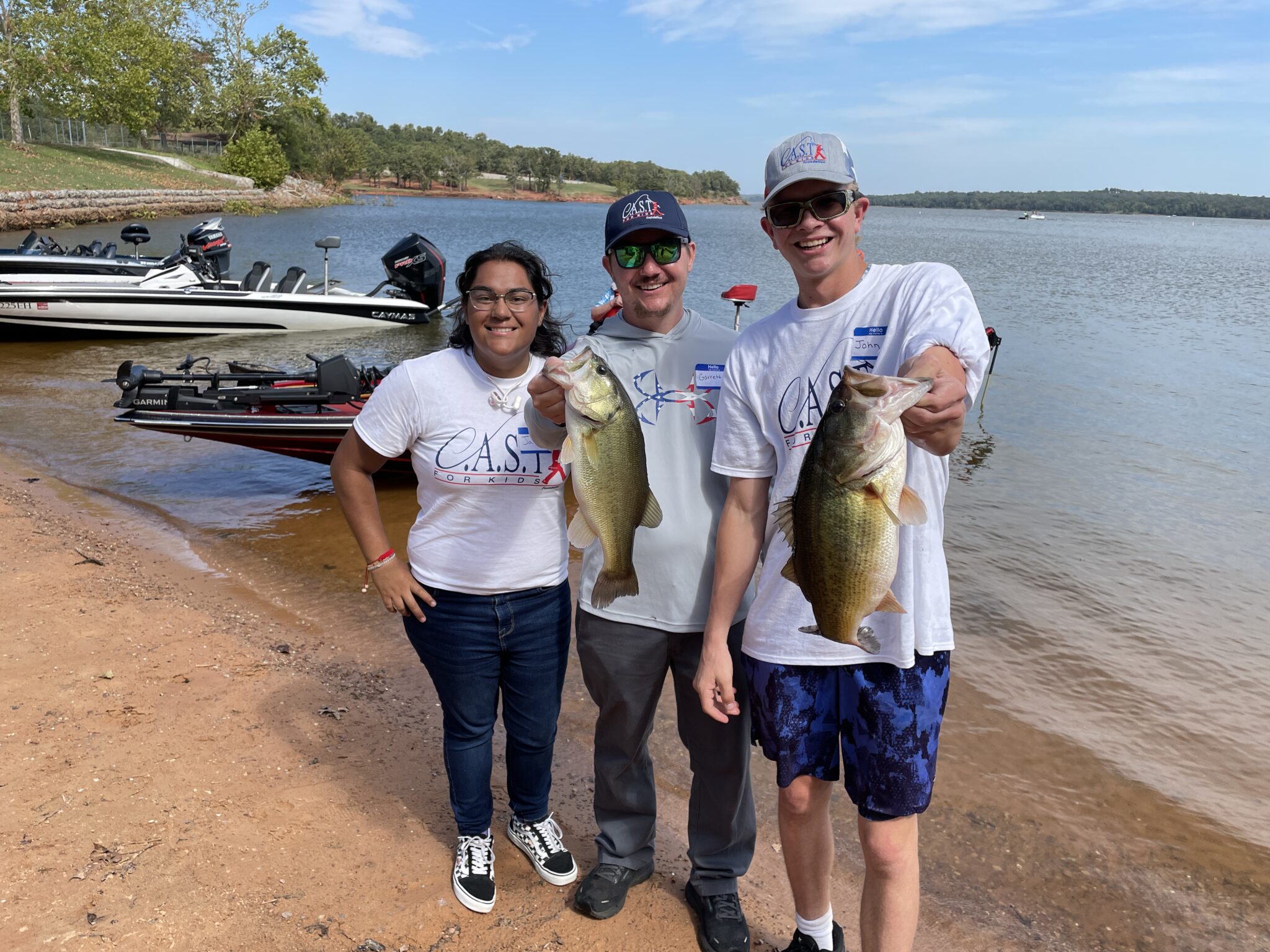 Lake Thunderbird1 three participants showing off fish at Lake Thunderbird