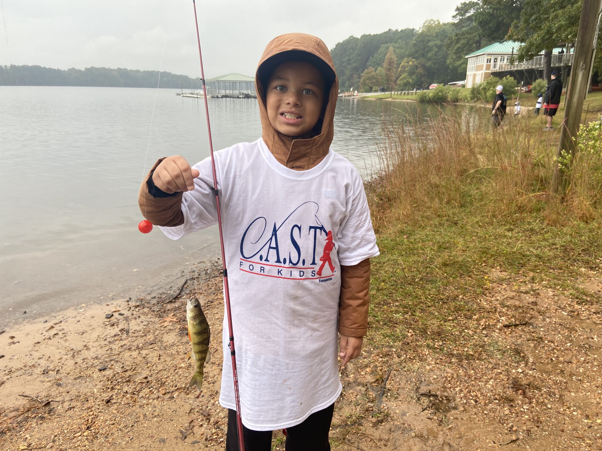 LakeWheeler1 child showing off fish at Lake Wheeler