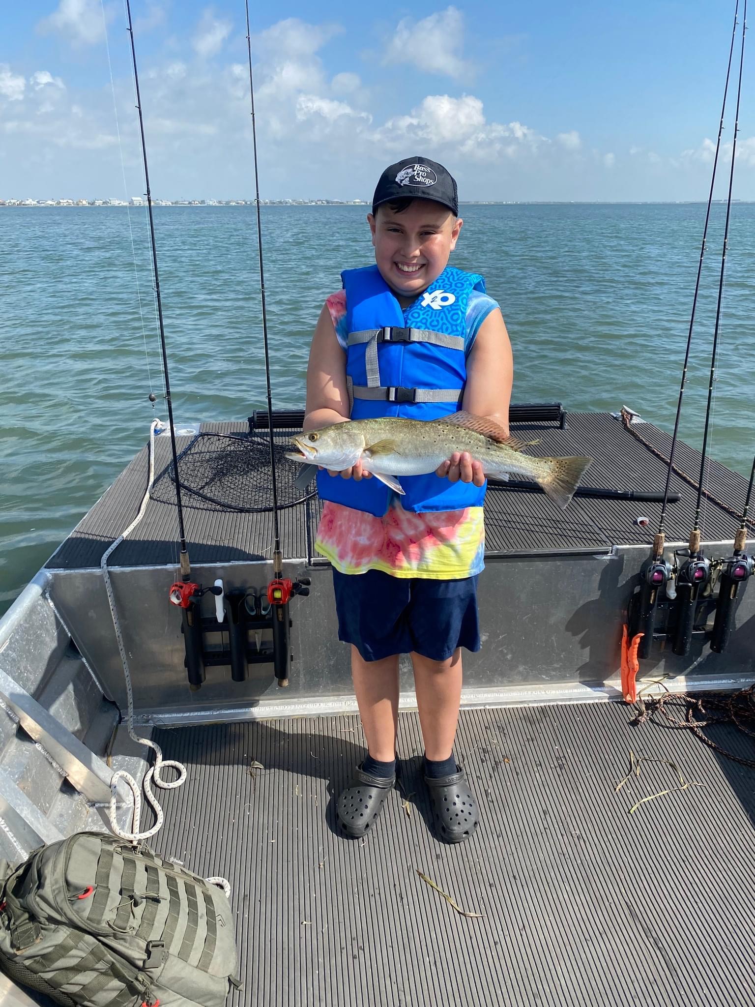 Rockport Beach4 boy showing off fish at rockport beach