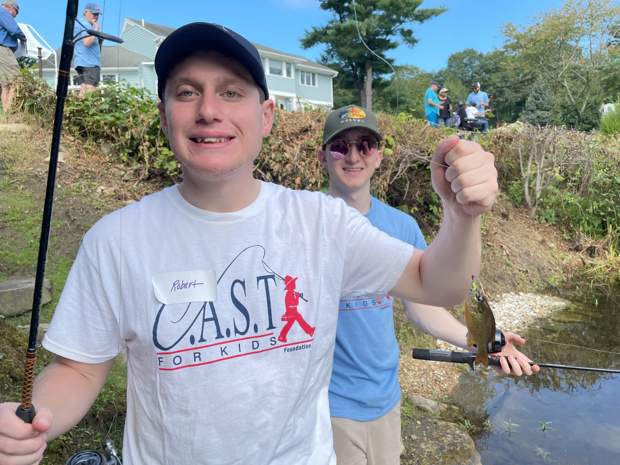 SaugatuckRiver3 participant showing off fish at Saugatuck River
