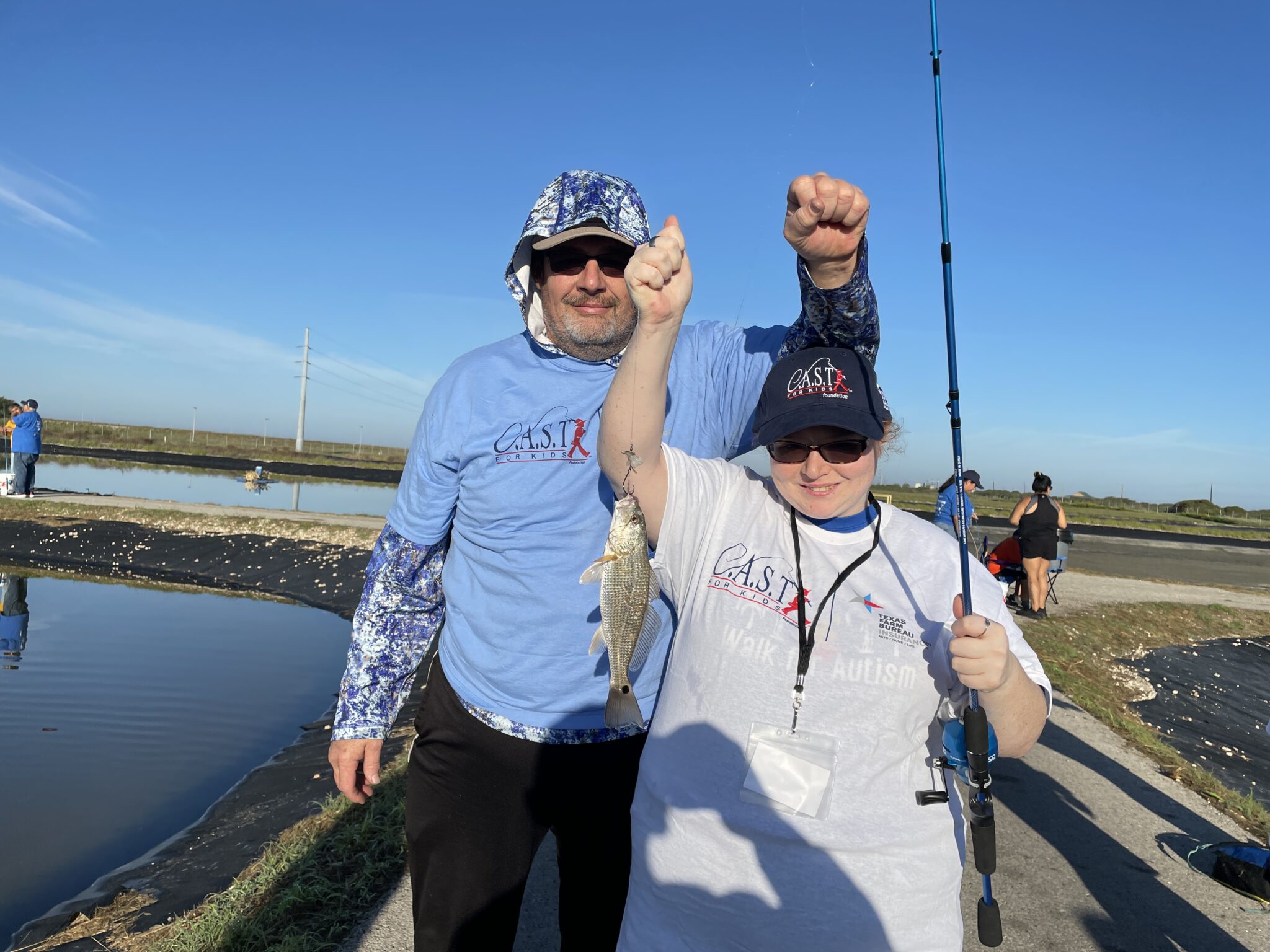 TPWD Hatcher Flour Bluff 4 participant holding fish at TPWD Hatchery Flour Bluff