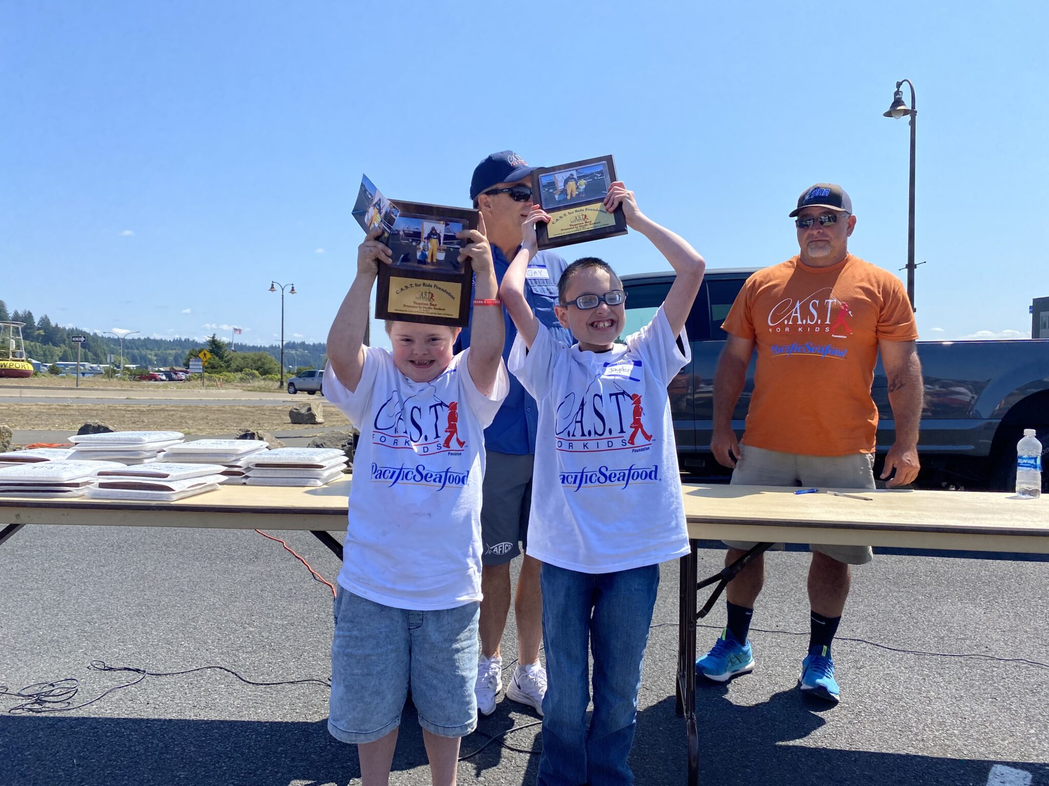 Yaquina Bay 2 Yaquina Bay participants holding plaques