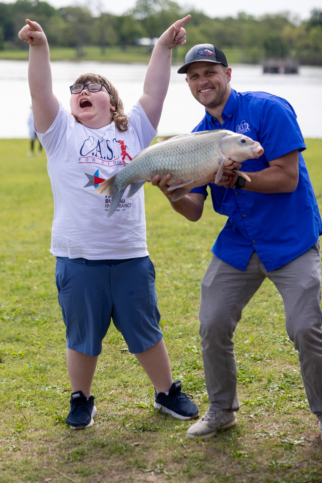 lakelavon2 volunteer and participant with a fish