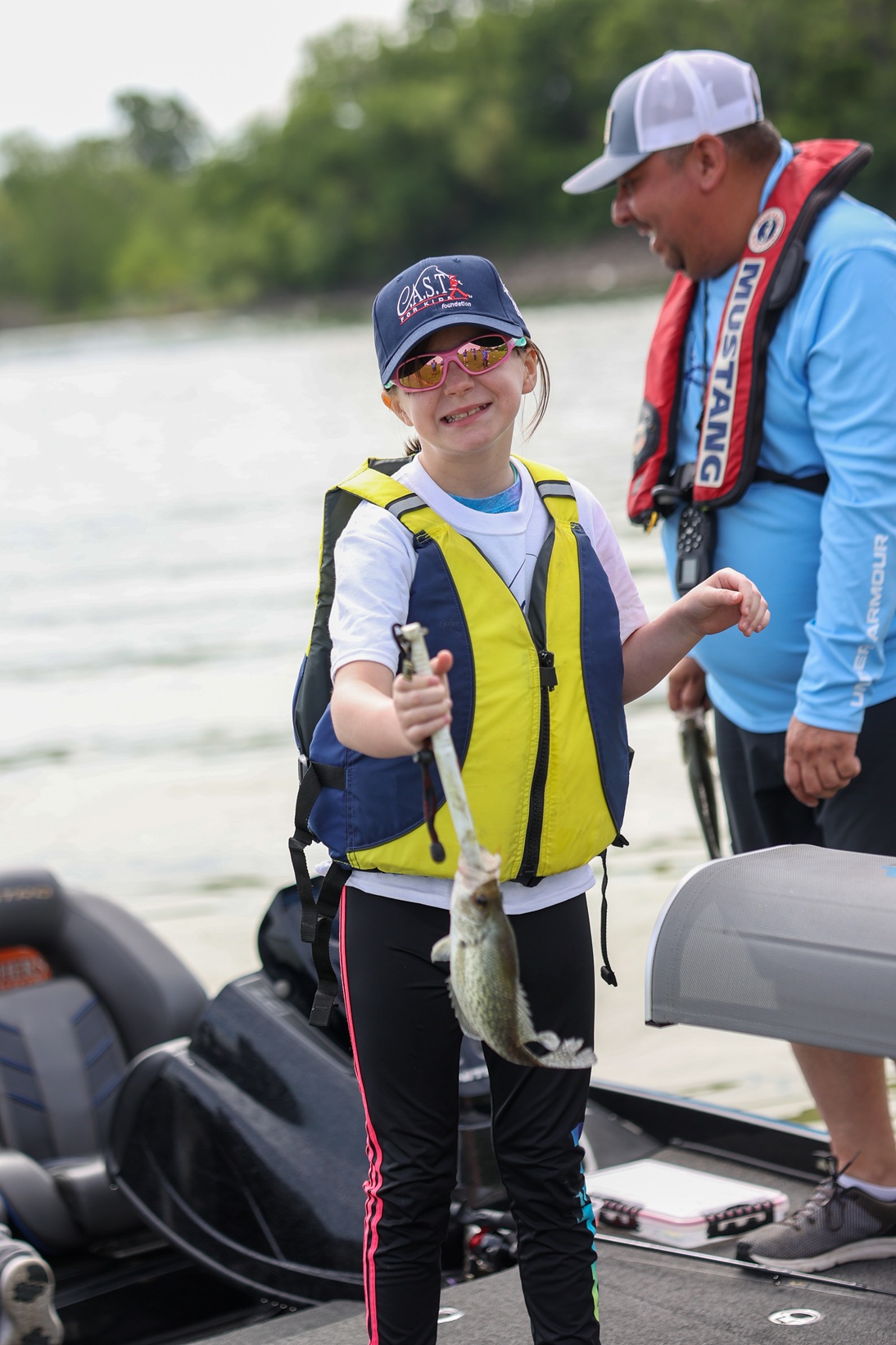 lakelavon3 volunteer and participant with a fish