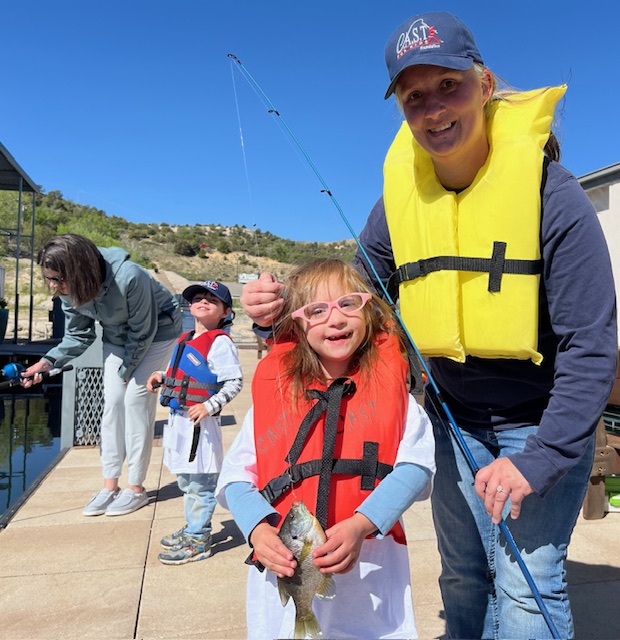 RE 3hrdrive volunteers youth with CAST volunteer wearing life jackets