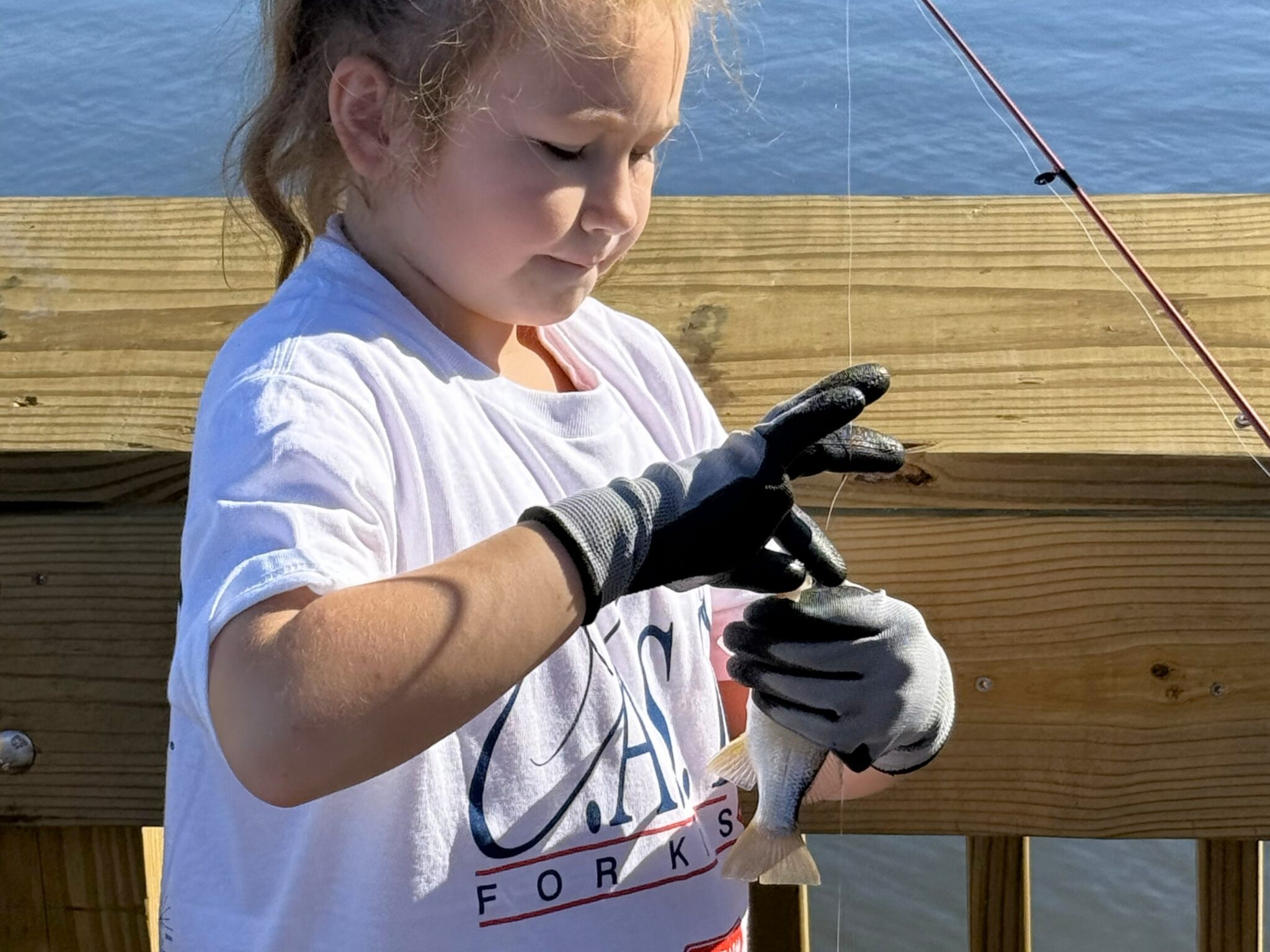 Participant showing off fish at Pearland Bass Pro Shops