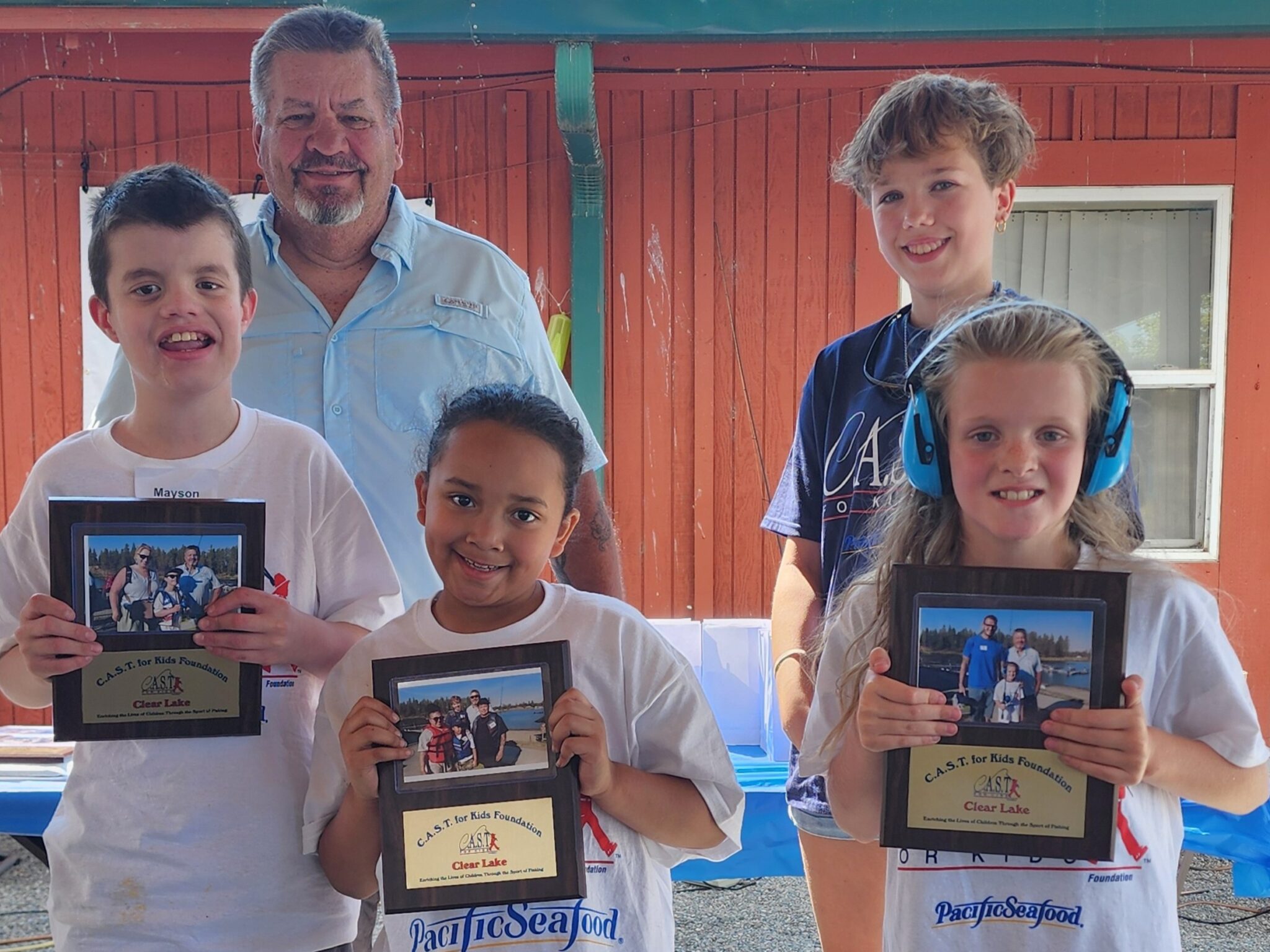 Participant showing off fish at clear lake