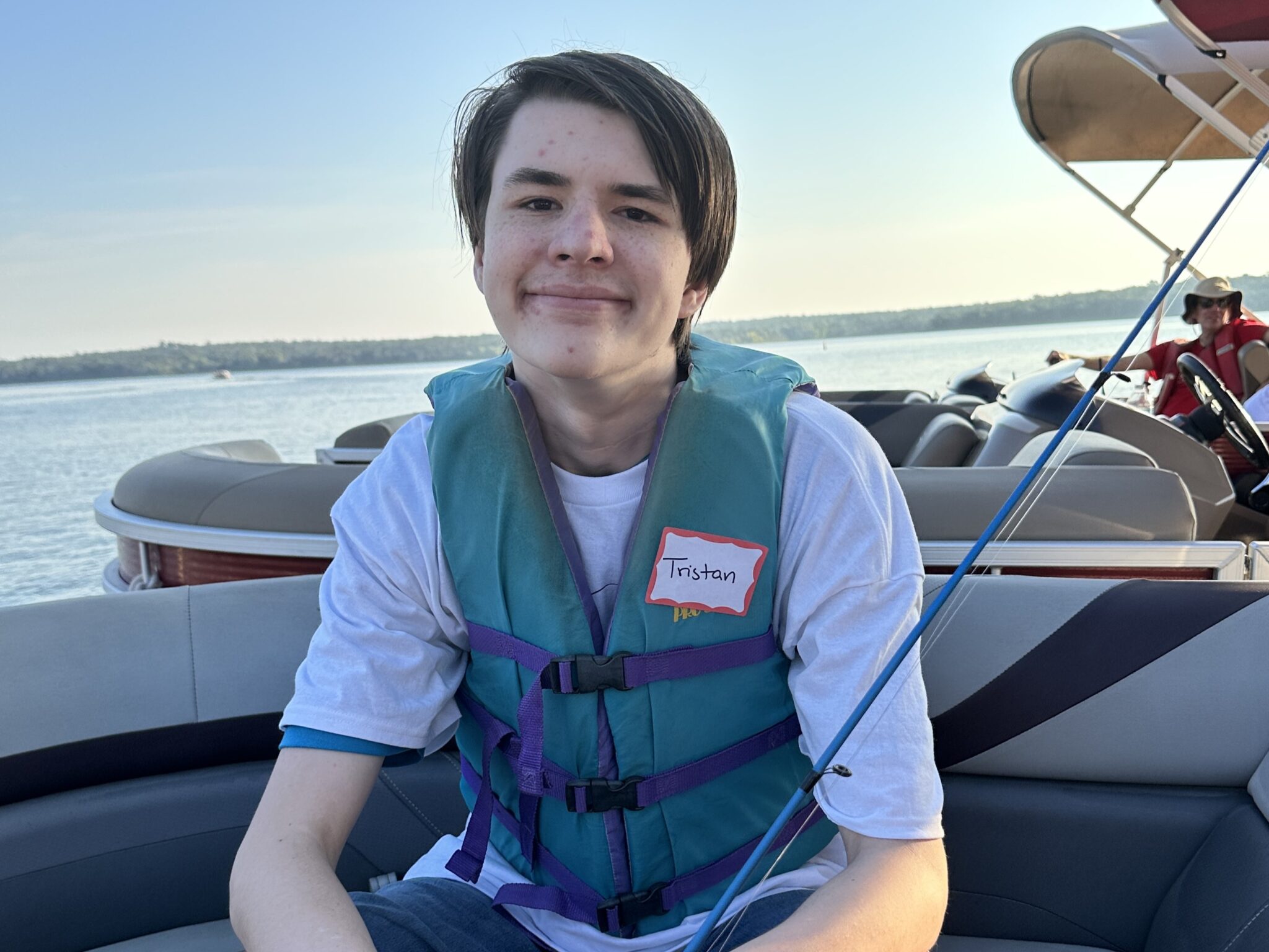 three participants showing off fish at Lake Thunderbird
