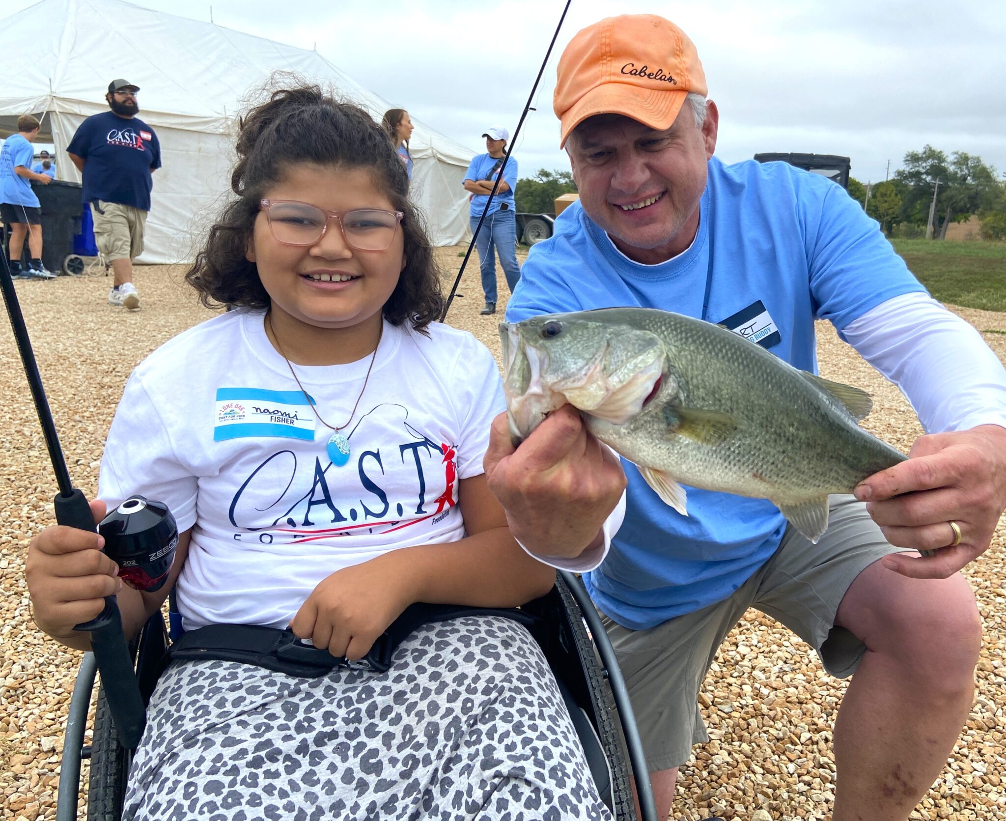 participant showing off fish at Saugatuck River